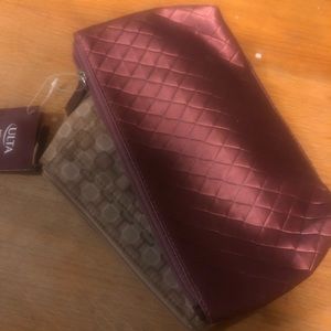 Two small make up cases.